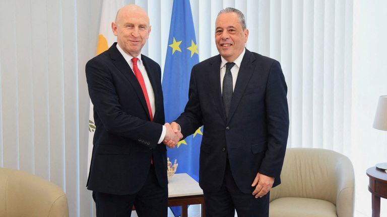 John Healey (left) meeting Cyprus' minister of defence Vasilis Palmas. Pic: Reuters
