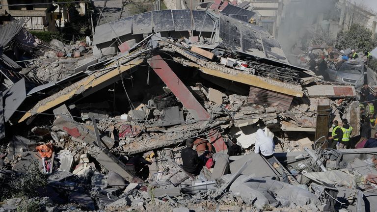 Rescue workers search for victims in Ghaziyeh, south Lebanon. Pic: AP