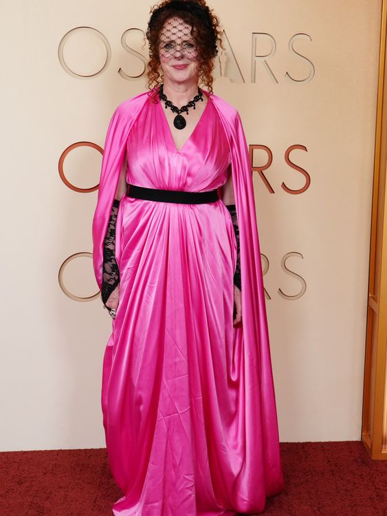 Hamnet author Maggie O'Farrell makes a splash in pink, lace gloves and a veil. Pic: AP