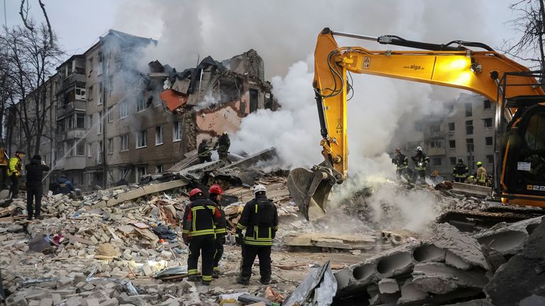 Rescuers at the scene. Pic: Reuters