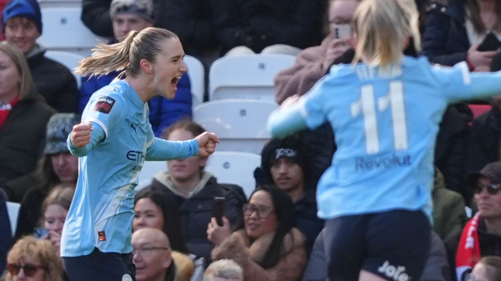 Vivianne Miedema (left) celebrates scoring the opening goal in the Manchester derby