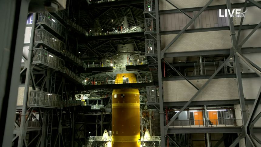 SLS and Orion are seen at the beginning of the Artemis II news conference on Thursday.