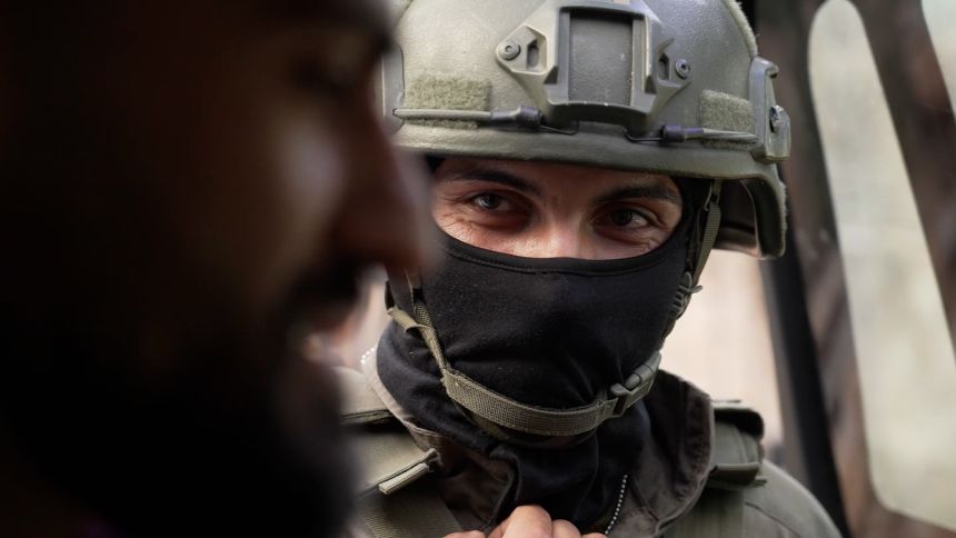 An Israeli soldier is seen while detaining the CNN team.