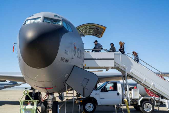 Retired Master Sgt. Eugene T. Beal and his family enters a KC-135 Stratotanker April 3, 2023, at Beale Air Force Base, California. Eugene visited Beale days before his 90th birthday to reunite with the airframe he flew in during his career as a boom operator. (U.S. Air Force photo by Staff Sgt. Ramon A. Adelan)