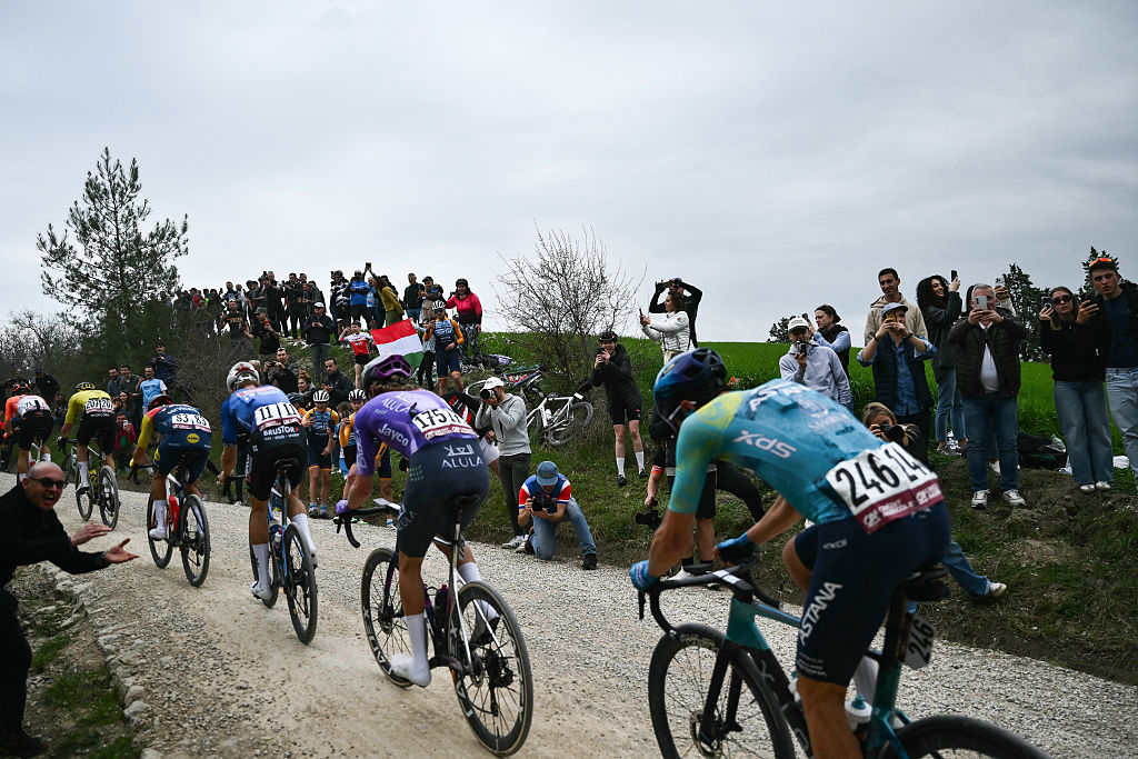 Supporters cheer the breakaway during the 20th one-day classic 'Strade Bianche' (White Roads) men's cycling race between Siena and Siena in Tuscany on March 7, 2026. (Photo by Marco BERTORELLO / AFP)