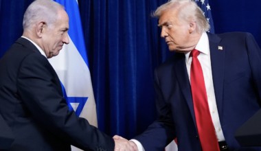 Donald Trump and Benjamin Netanyahu shaking hands in front of an Israeli flag.