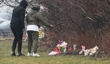 Mother of 2 girls found in shallow graves charged with murder