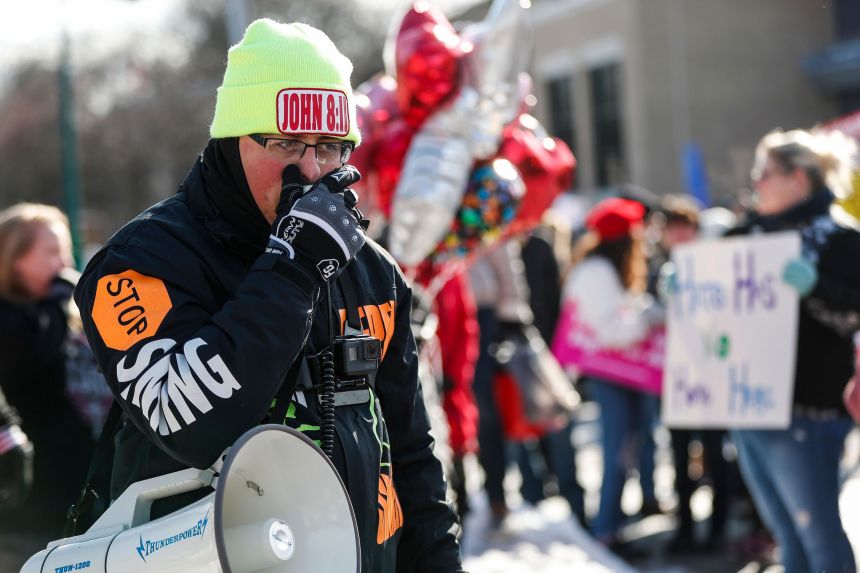 Gabriel Olivier protests a drag queen story time event outside of Huntington Woods Public Library in Huntington Woods, Michigan, in January 2019.