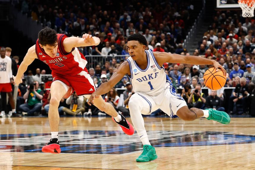 Duke Blue Devils guard Caleb Foster dribbles against St. John's Red Storm guard Dylan Darlingin the first half during Sweet Sixteen game on Friday.