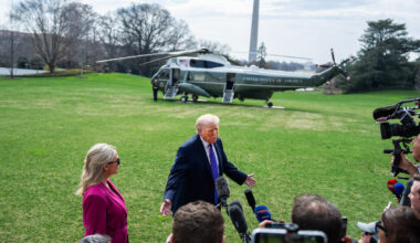 President Donald Trump speaks with reporters on the South Lawn of the White House before boarding Marine One en route to Ohio and Kentucky on Wednesday. Karoline Leavitt, White House press secretary, stands to Trump’s right.