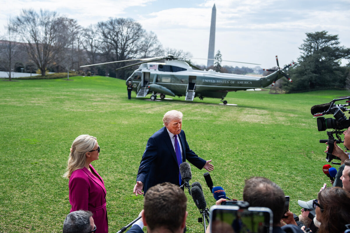 President Donald Trump speaks with reporters on the South Lawn of the White House before boarding Marine One en route to Ohio and Kentucky on Wednesday. Karoline Leavitt, White House press secretary, stands to Trump’s right.
