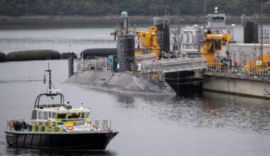 Iranian and Romanian charged after trying to enter UK's nuclear submarine base