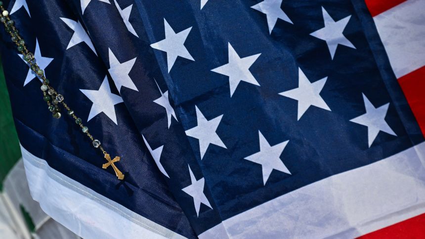 A US flag with a rosary is pictured ahead a Holy Mass for the Beginning of the Pontificate of Pope Leo XIV, in St Peter's Square in The Vatican on May 18, 2025.