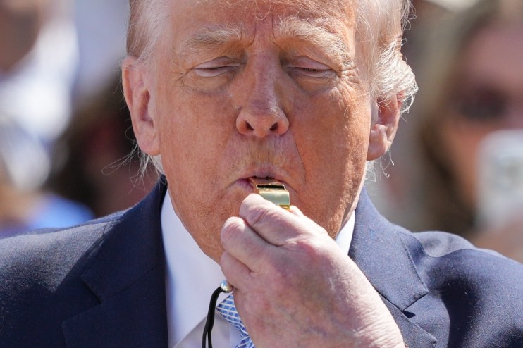 General news article image depicting a current event, featuring people in a business setting discussing a topic.