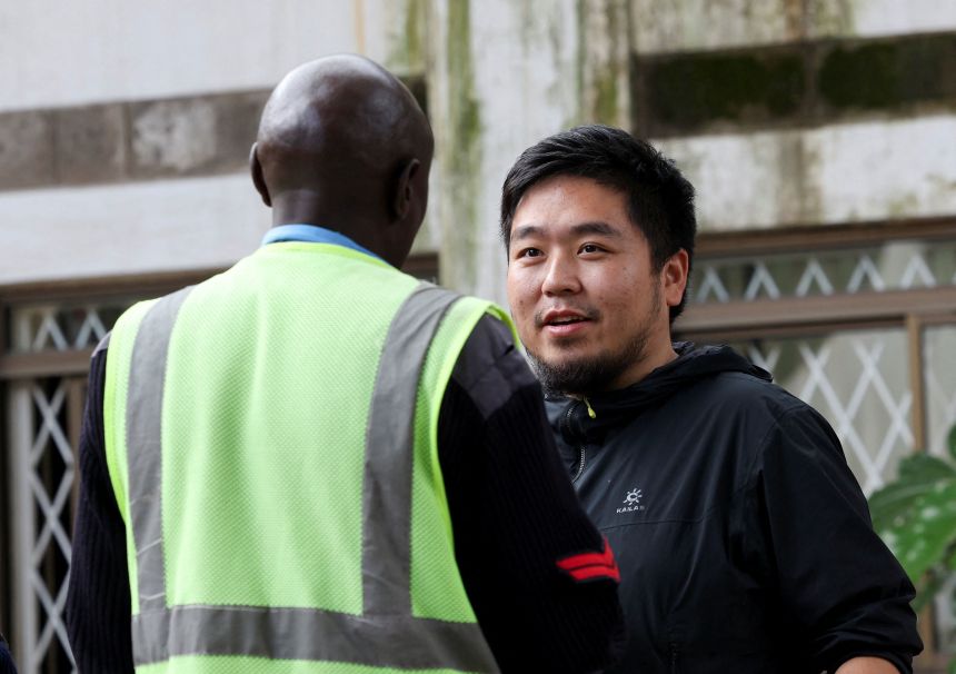 Zhang Kequn stands outside the courtroom in Nairobi before his sentencing on Wednesday.