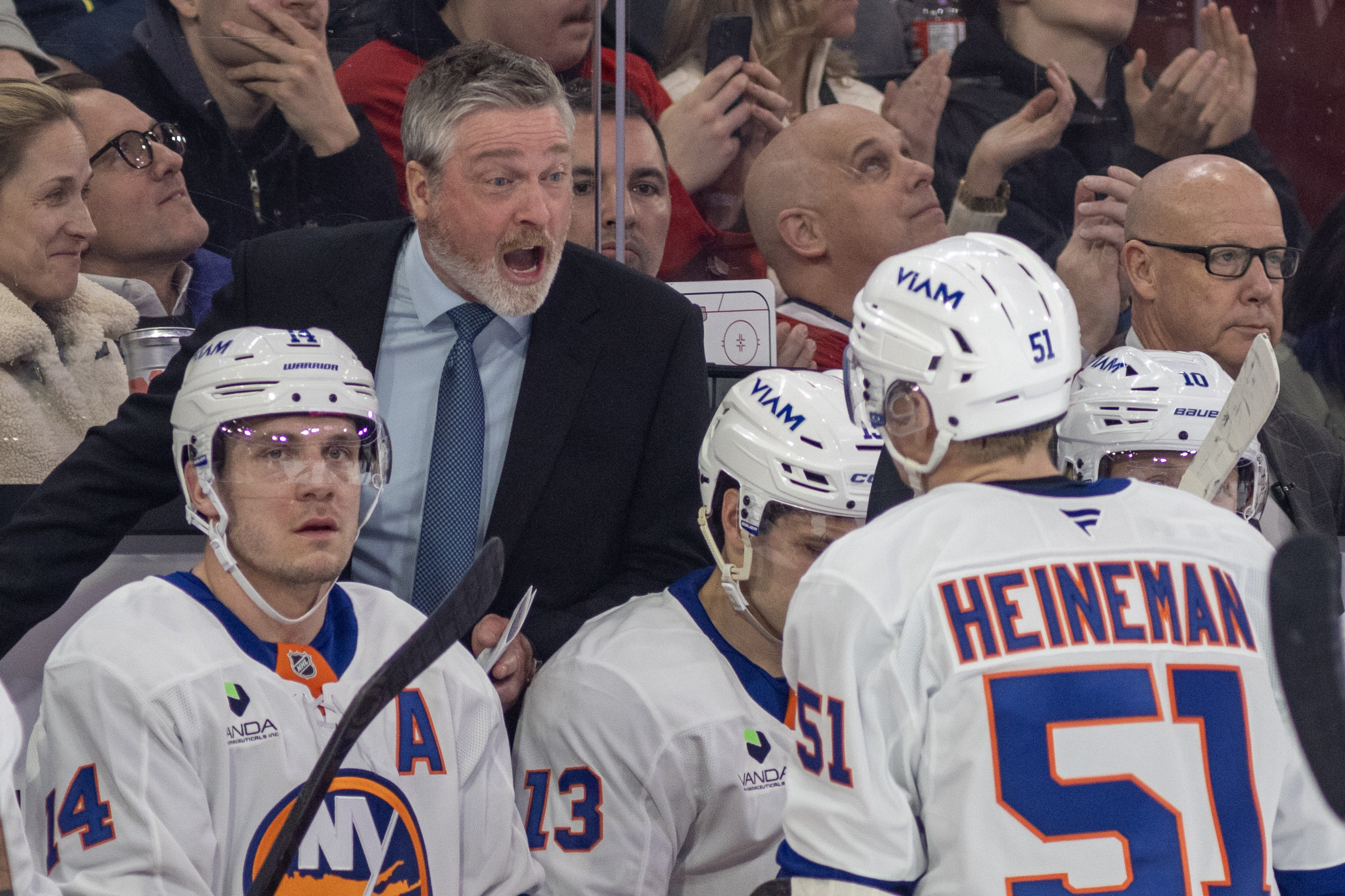 New York Islanders head coach Patrick Roy shouts instructions to Emil Heineman during first period in Montreal on Feb. 26.