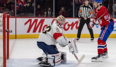 The puck flies into the net behind the Florida Panthers goalie while a Canadiens player follows through on a shot