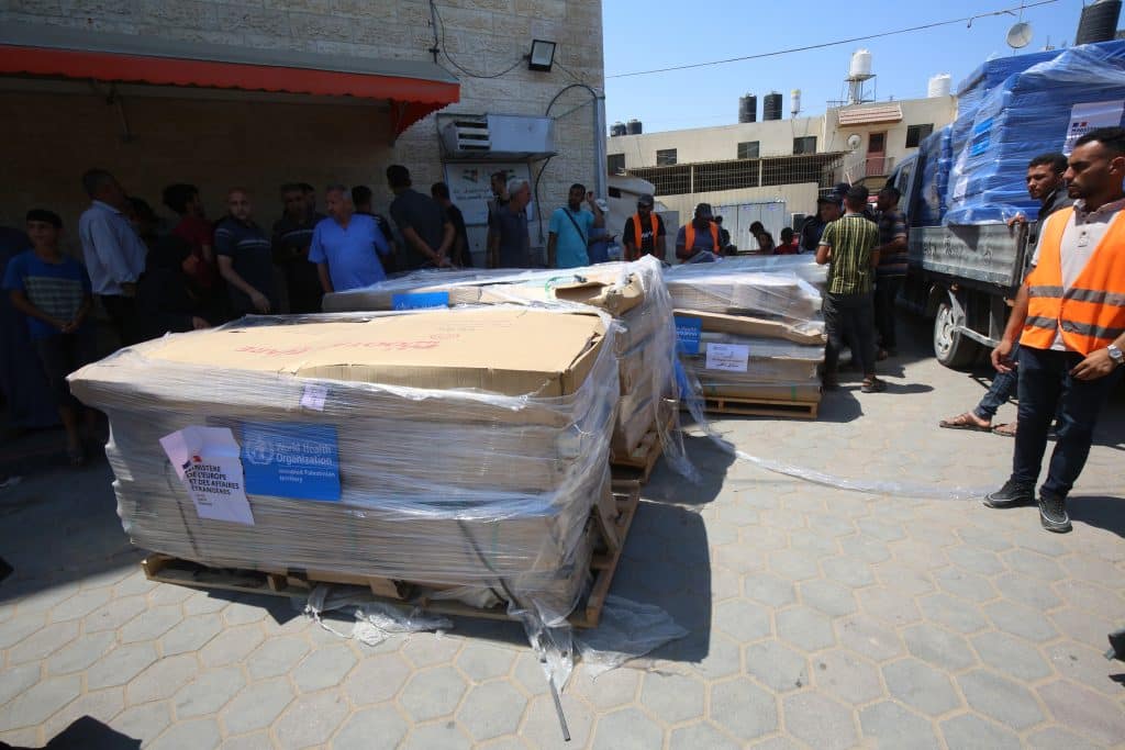 Aid workers transport medical aid to Shuhada Hospital in Deir al-Balah, central Gaza, July 4, 2024. (Photo: Ali Hamad/APA Images)