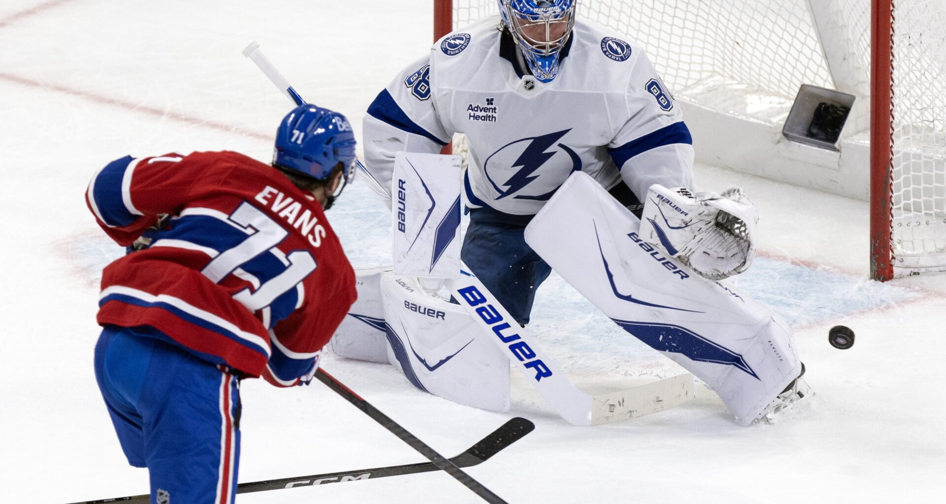 Tampa Bay Lightning goalie Andrei Vasilevskiy, stopping Canadiens' Jake Evans in Montreal on April 9, has a career 16-5-2 regular-season record against the Canadiens and a career .918 save percentage in the playoffs.