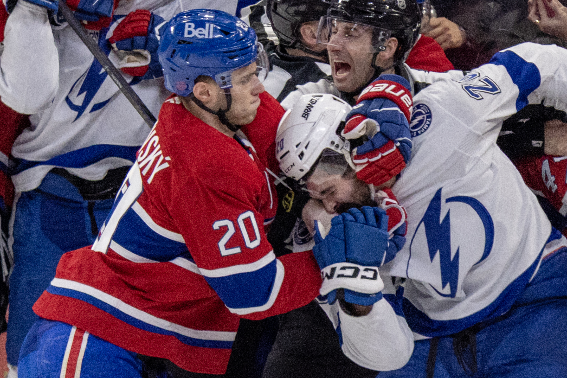 Canadiens' Juraj Slafkovsky pulls Tampa Bay Lightning Nick Paul out of a scrum after the whistle during second period in Montreal on April 9, 2026.