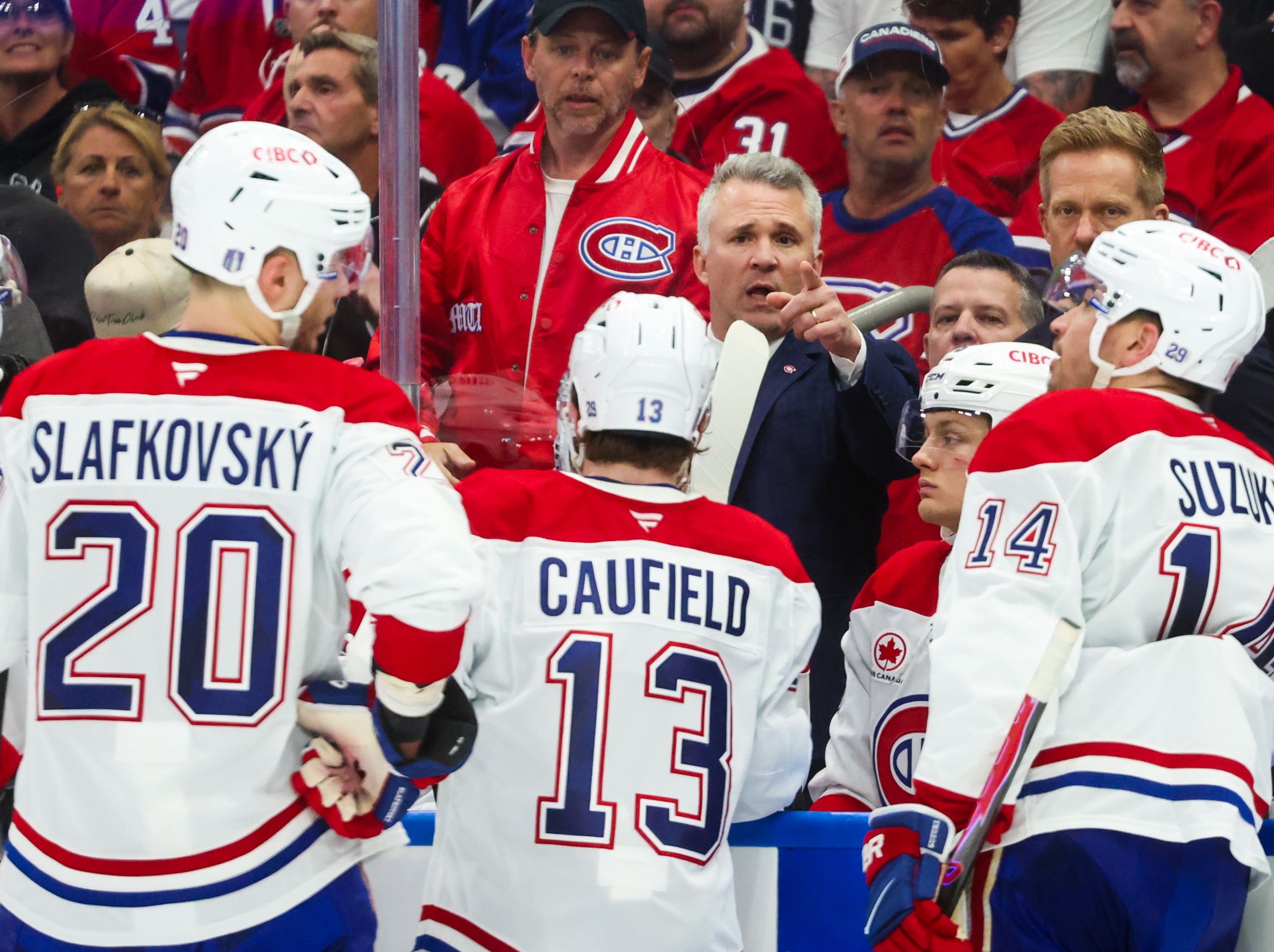 Montreal Canadiens head coach Martin St. Louis talks with his team