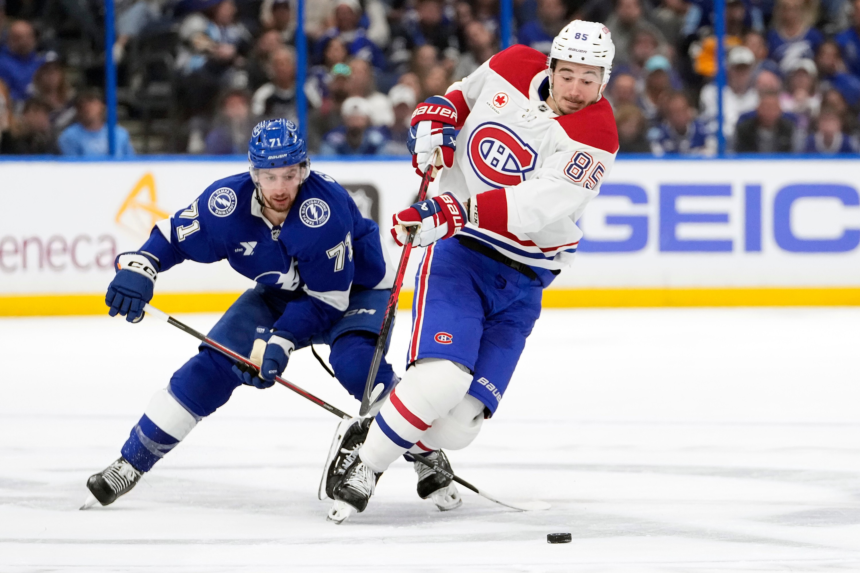 Lightning centre Anthony Cirelli trips Canadiens winger Alexandre Texier during the first period of Game 2 on Tuesday in Tampa, Fla.