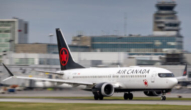 A jet plane speeds down the runway ahead of takeoff