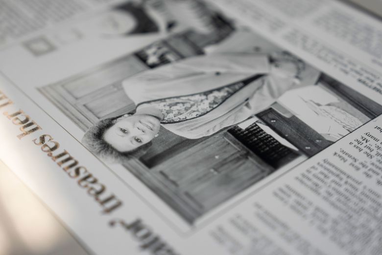 Louise Lucas shows a newspaper clipping from early in her career.