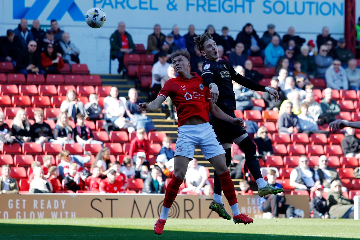 Ronan Curtis of Plymouth Argyle wins a header during the Sky Bet EFL League One match between Barnsley and Plymouth Argyle at Oakwell Stadium on 6 April 2026 in Barnsley, England (Photo by Steve Taylor/PPAUK)