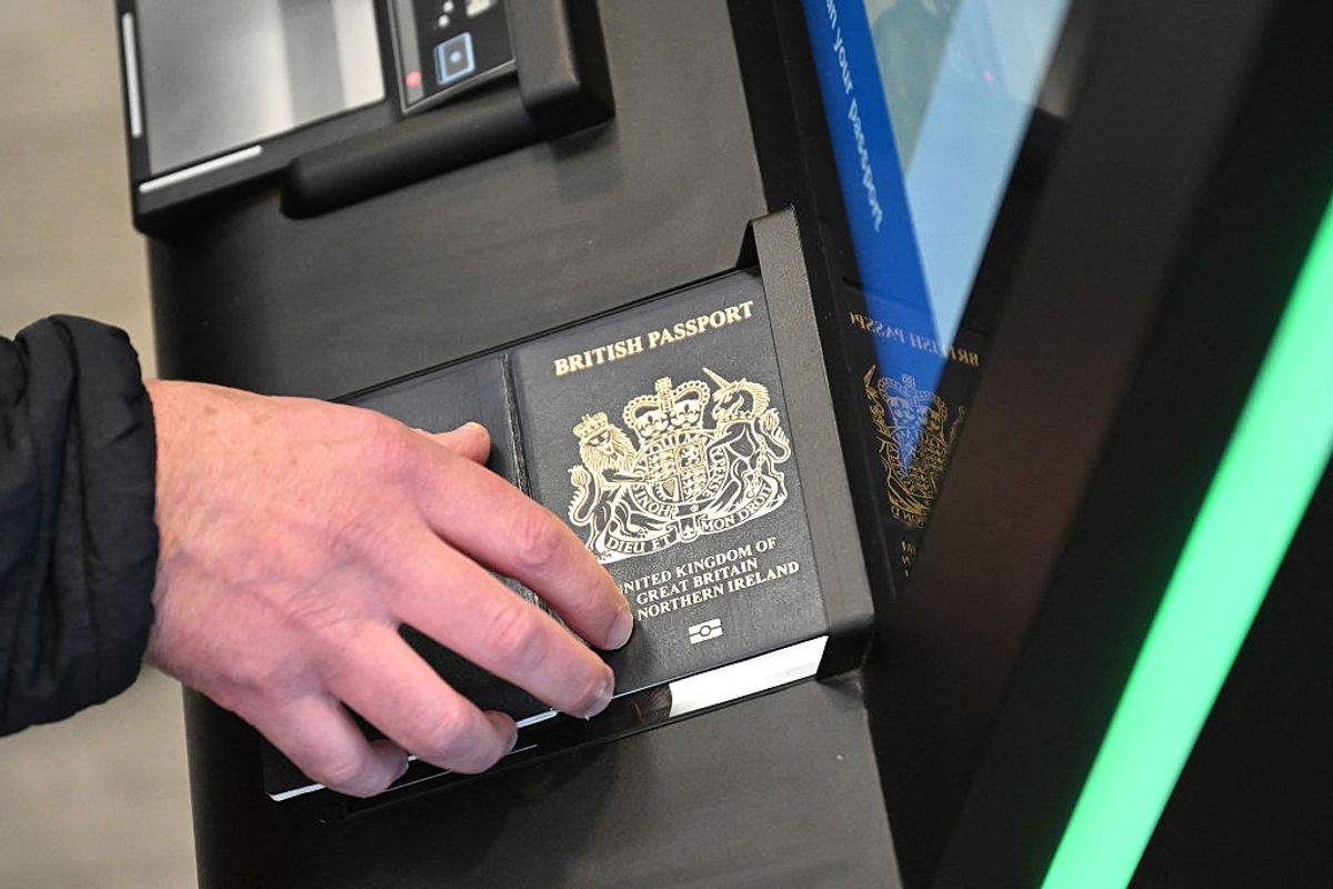 A person as their passport scanned whilst using an Automated European Union Entry/Exit System (EES)