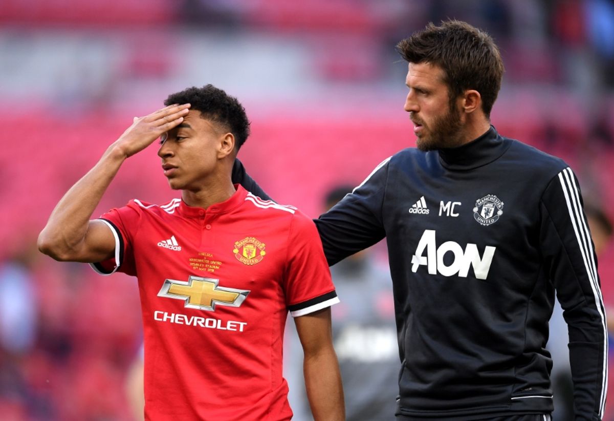 Michael Carrick of Manchester United consoles Jesse Lingard of Manchester United following The Emirates FA Cup Final between Chelsea and Manchester United at Wembley Stadium on May 19, 2018 in London, England.