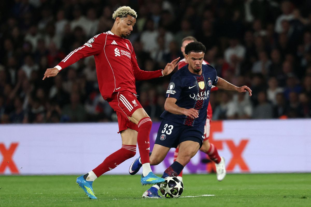 Hugo Ekitike battles for the ball against PSG