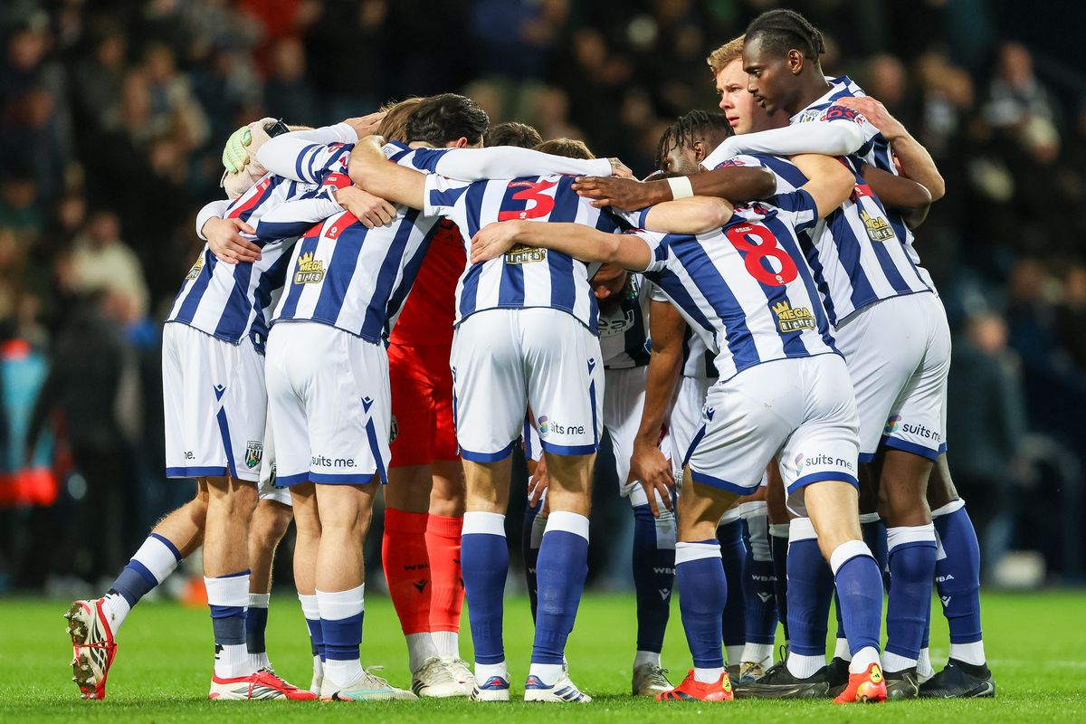 West Brom players in a huddle before a game