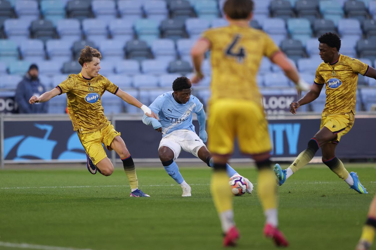 MANCHESTER, ENGLAND - APRIL 10: Ryan McAidoo of Manchester City scores their side's first goal during the FA Youth Cup Semi Final match between Manchester City and Blackburn Rovers at Joie Stadium on April 10, 2026 in Manchester, England. (Photo by James Gill - Danehouse/Getty Images)