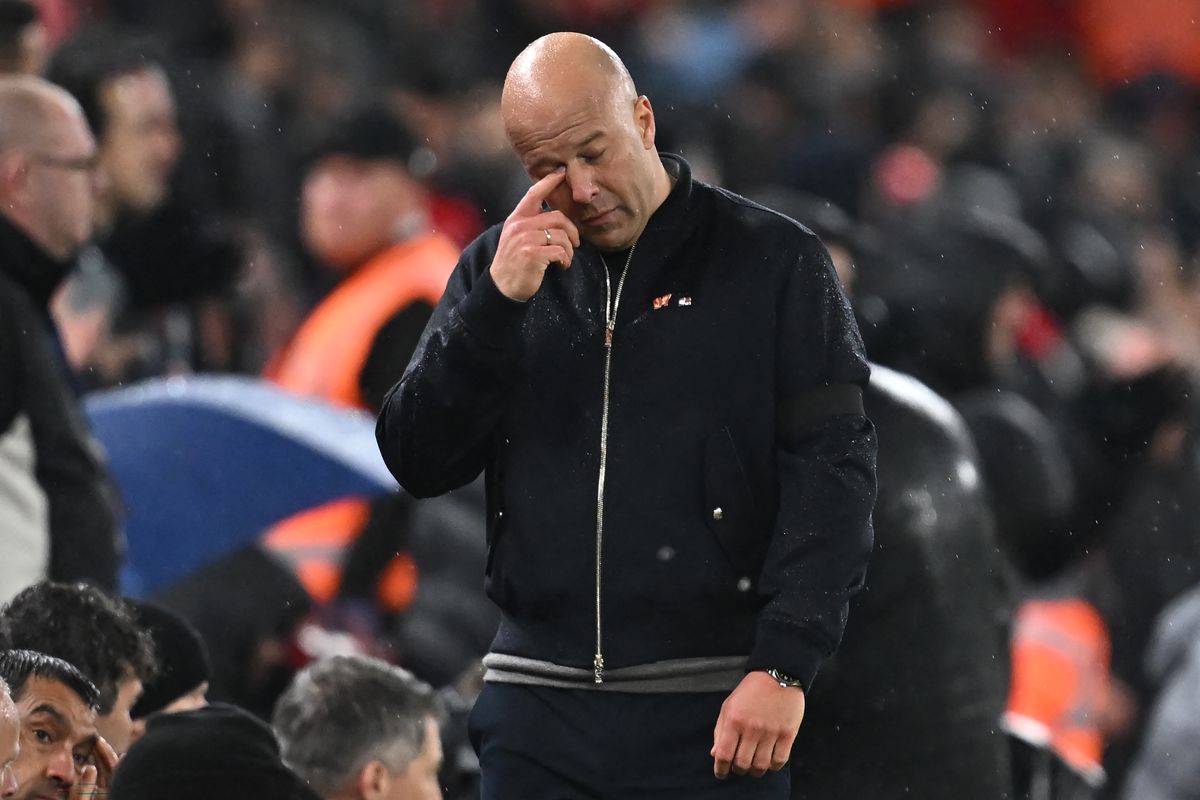 Liverpool's Dutch manager Arne Slot reacts after conceding the second goal during the UEFA Champions League quarter final, second-leg football match between Liverpool and Paris Saint-Germain at Anfield in Liverpool