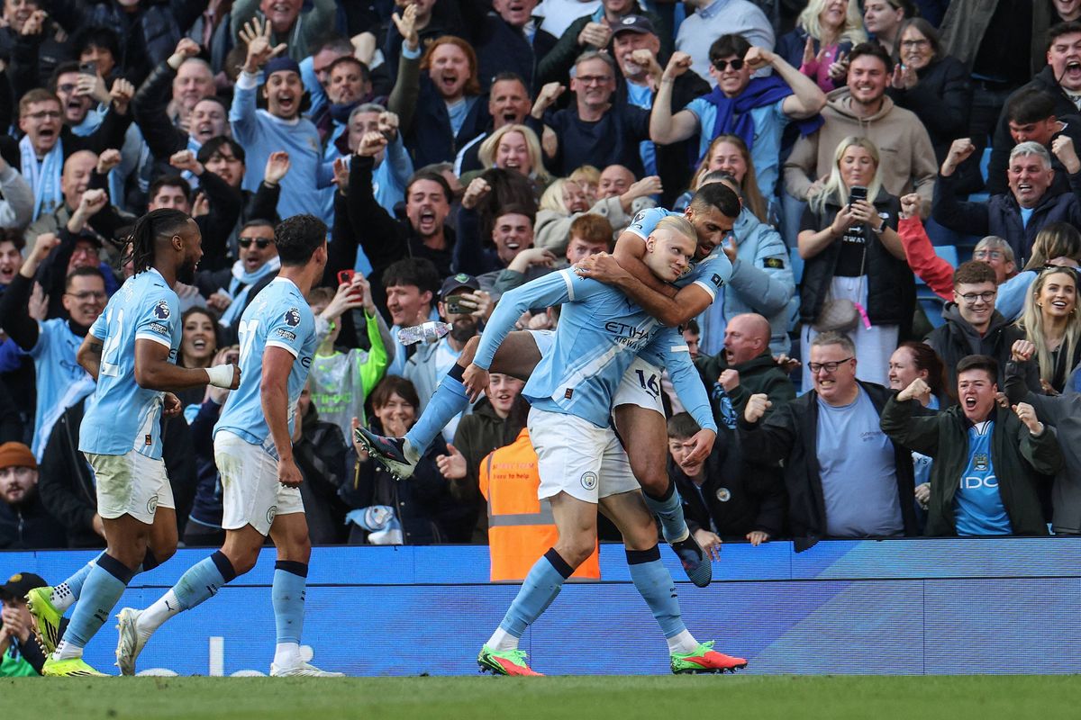 Manchester City's Norwegian striker #09 Erling Haaland (front R) celebrates after scoring his team's second goal during the English Premier League football match between Manchester City and Arsenal at the Etihad Stadium in Manchester, north west England, on April 19, 2026