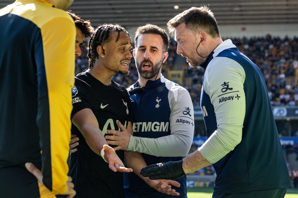 Xavi Simons reacts after being injured during the Premier League match between Wolverhampton Wanderers and Tottenham Hotspur at Molineux