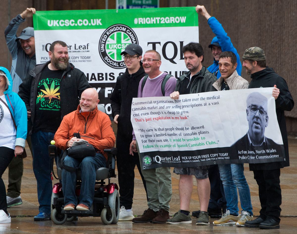 Gary Youds, pictured wearing a light pink jumper, with his supporters outside Liverpool Crown Court in Derby Square.