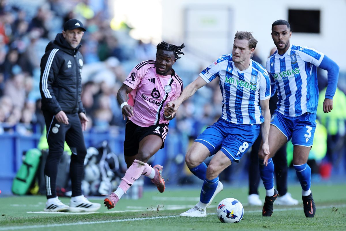 Abdul Fatawu of Leicester City in action with Svante Ingelsson of Sheffield Wednesday