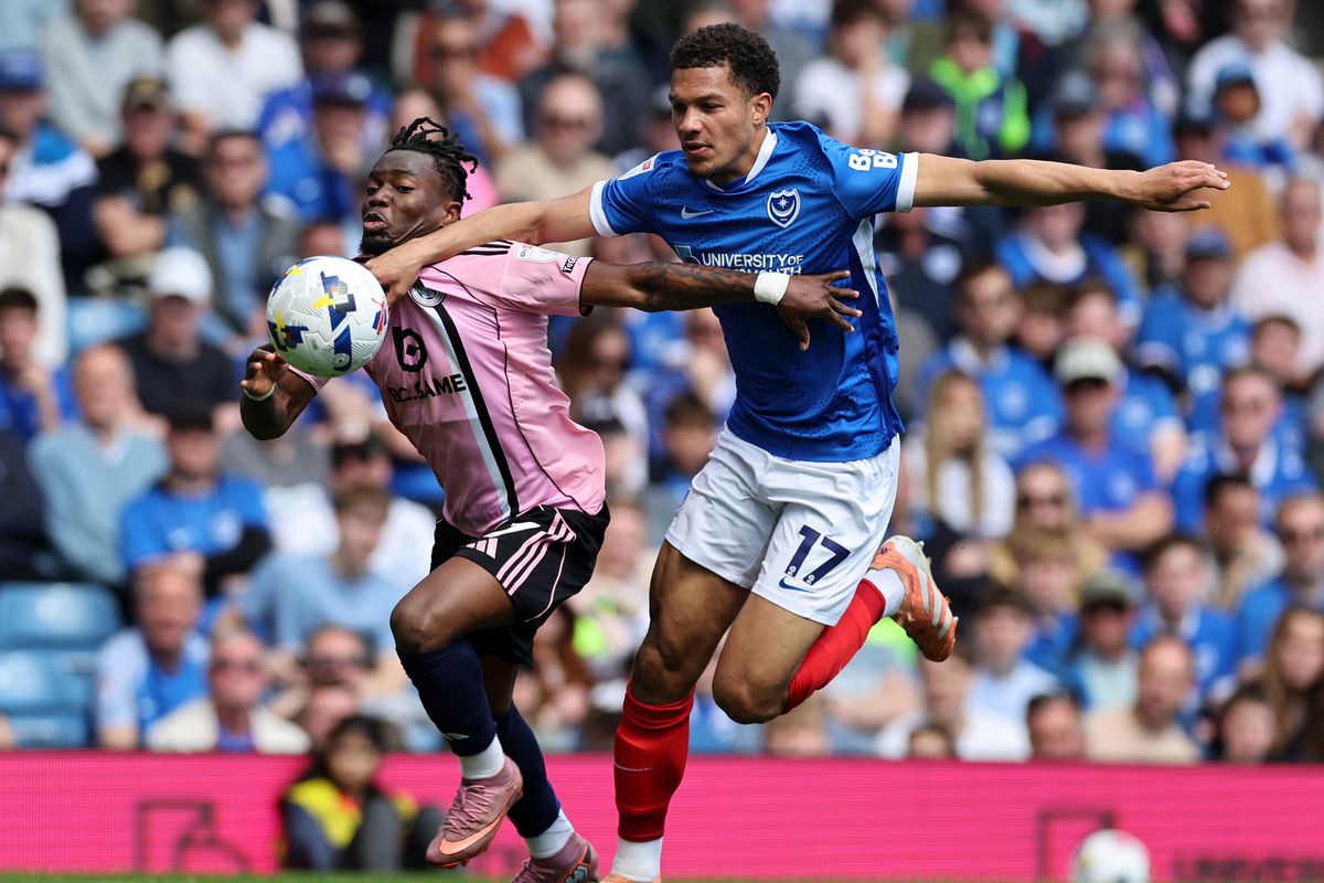 Abdul Fatawu of Leicester City in action with Ibane Bowat of Portsmouth during the Sky Bet Championship match between Portsmouth and Leicester City at Fratton Park