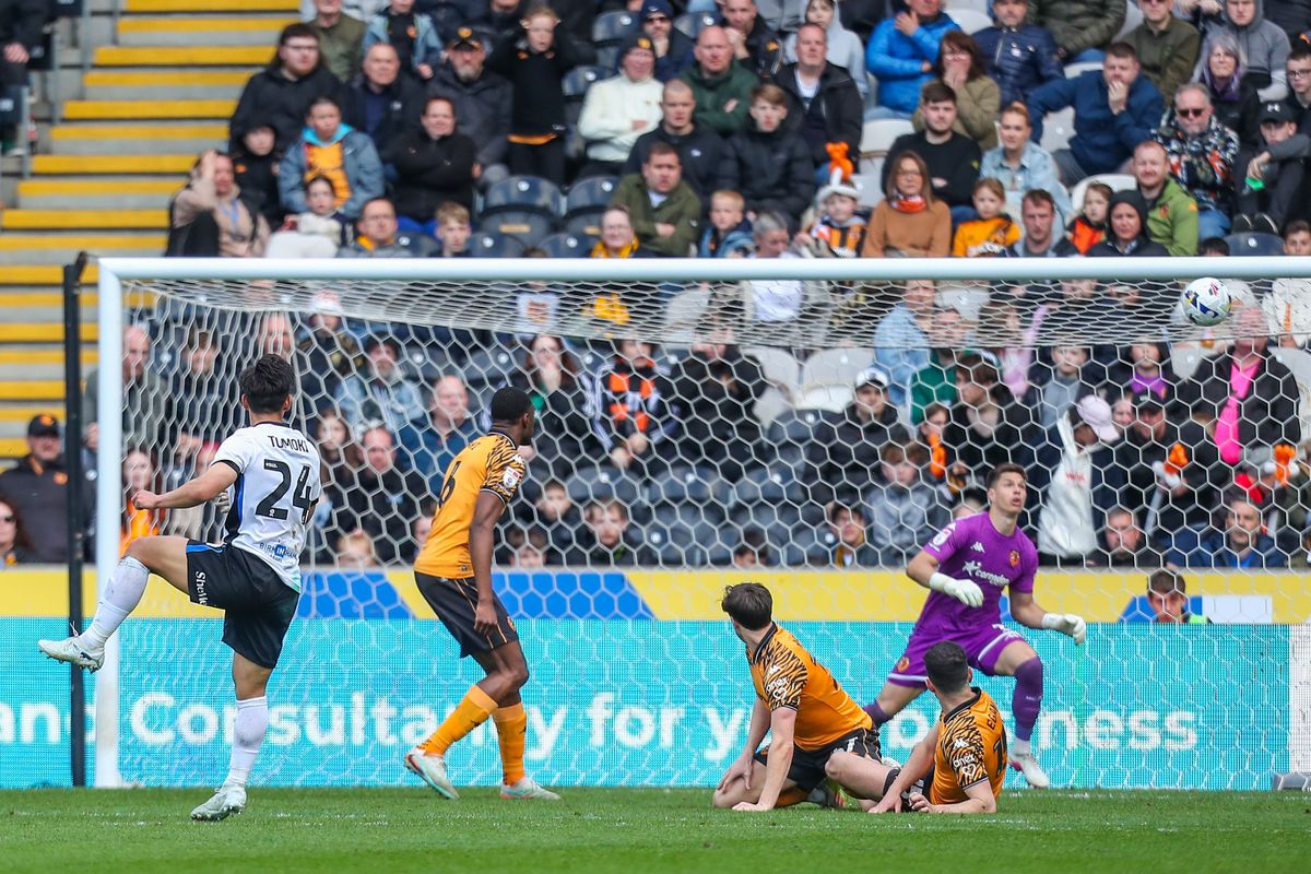Birmingham City's Tomoki Iwata scores at the MKM Stadium, Hull. 