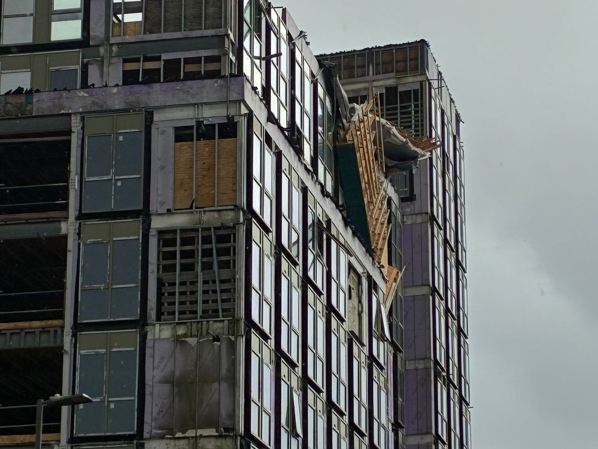 A large chunk of material has come away from a building block under construction