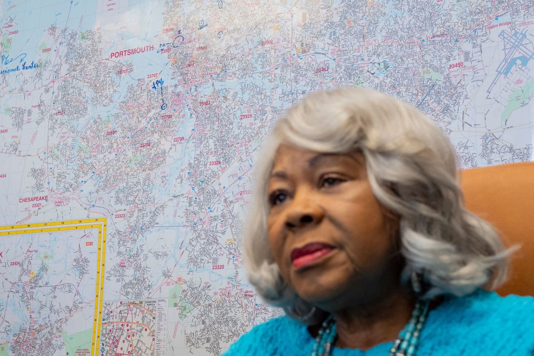 A map of Portsmouth, Virginia, and the surrounding area adorns the wall behind Lucas, at her office.