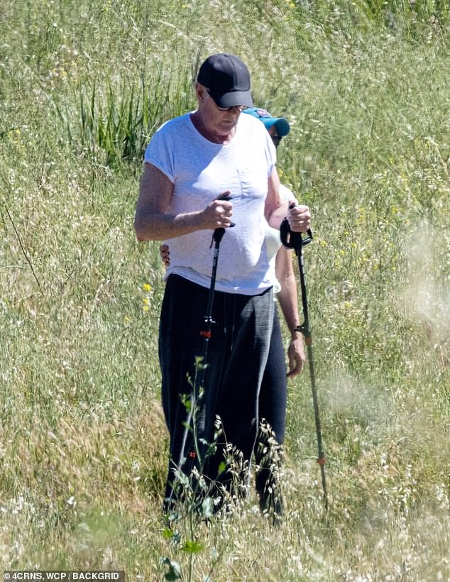 Despite his improving mobility, Hasselhoff appeared to still need some assistance from his wife, who was seen grasping his arm and holding a hand on his back