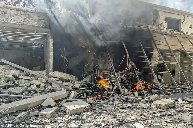 The aftermath of an Israeli strike in Lebanon. Iran claims a ceasefire in Lebanon is key to peace talks with the regime and US