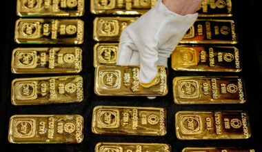 Gold slips from one‑month high on firmer dollar; U.S.–Iran talks in focus