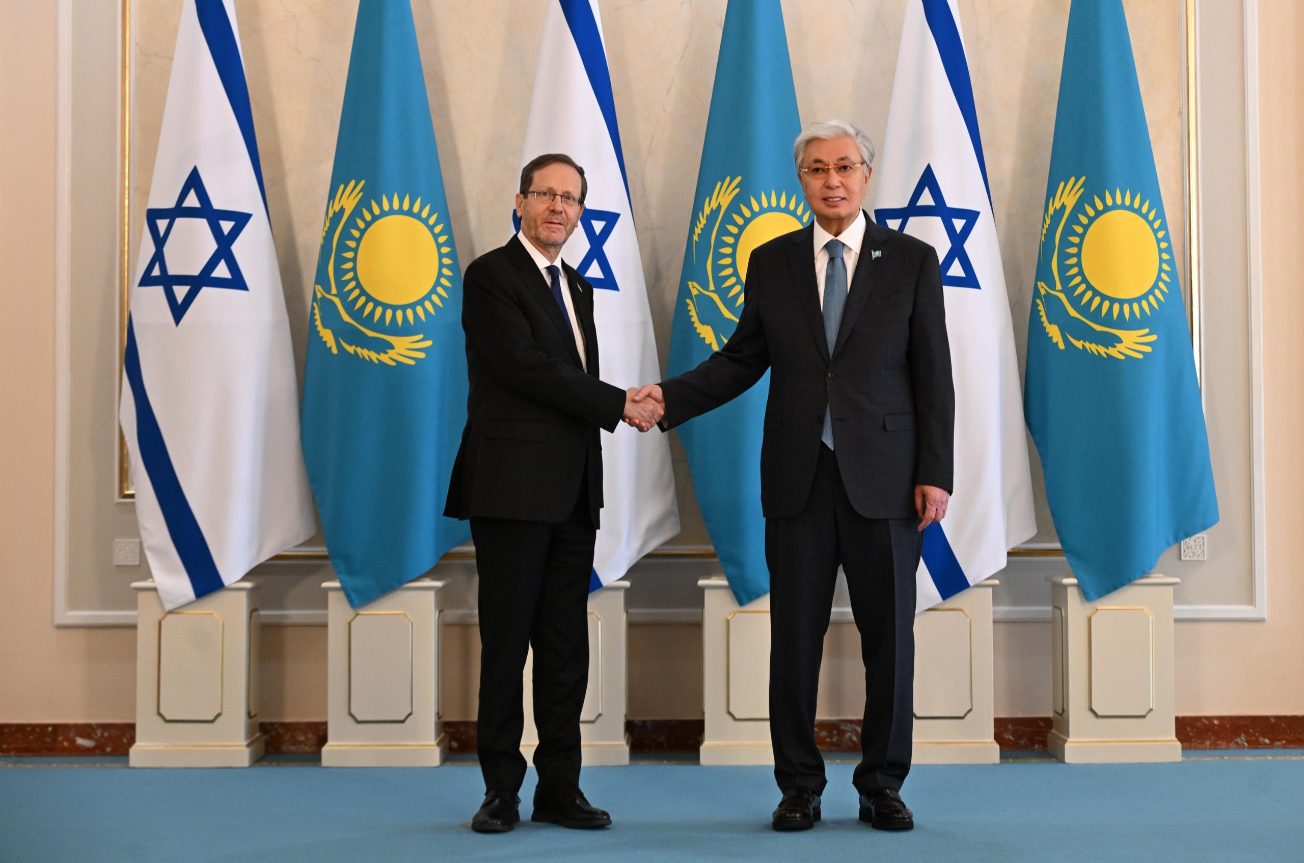 Kazakhstan's president, Kassym-Jomart Tokayev, right, shakes hands with his Israeli counterpert, Isaac Herzog at the presidential residence in Astana, Kazakhstan on April 27, 2026. Photo by Haim Zach/GPO.