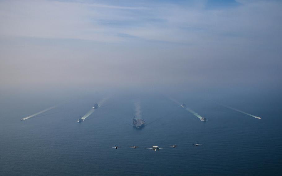 USS Abraham Lincoln and Carrier Air Wing 9 transit in formation in the Arabian Sea.