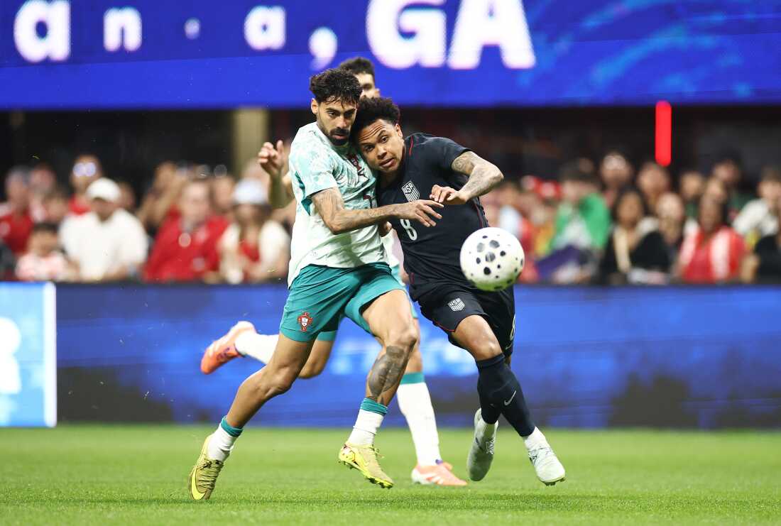Weston McKennie of the United States (right) and Samu Costa of Portugal compete for the ball during a match in Atlanta on Tuesday. Portugal defeated the U.S. 2-0, giving the USMNT another disappointing loss ahead of this summer's World Cup.