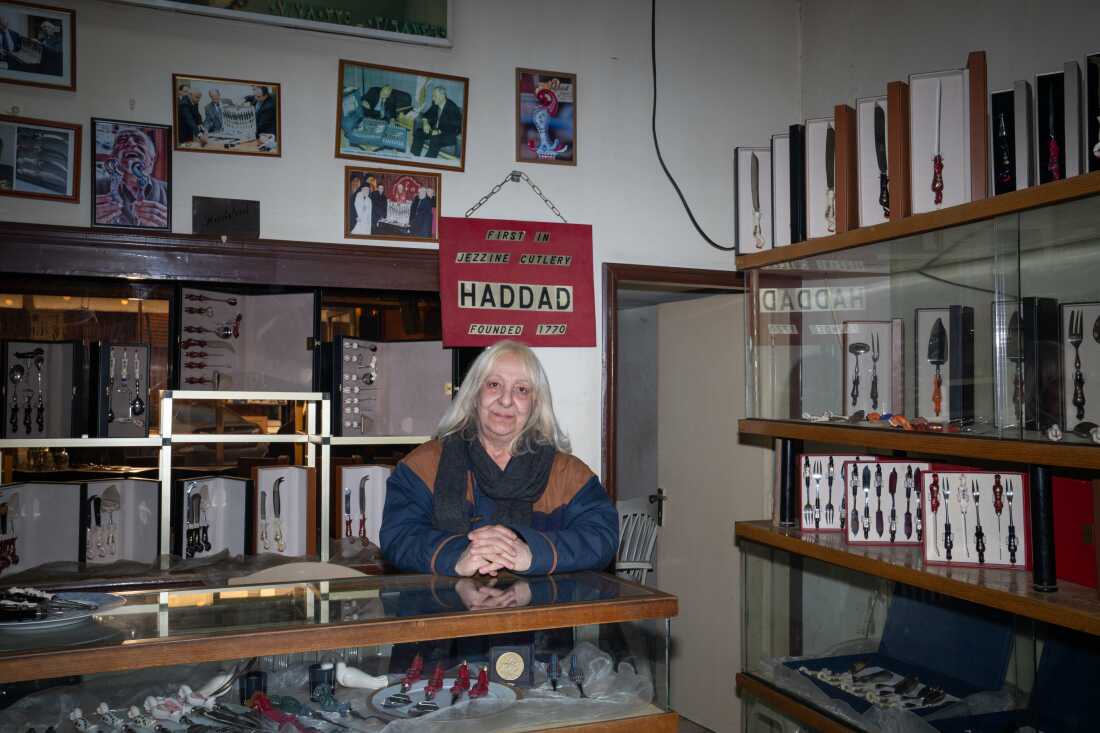 Grace Rizk, 65, works at a shop selling locally made cutlery in downtown Jezzine. After living here for 15 years she says the war will never make her leave.
